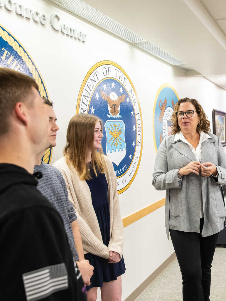 students chatting in the veterans resource center at the dedication
