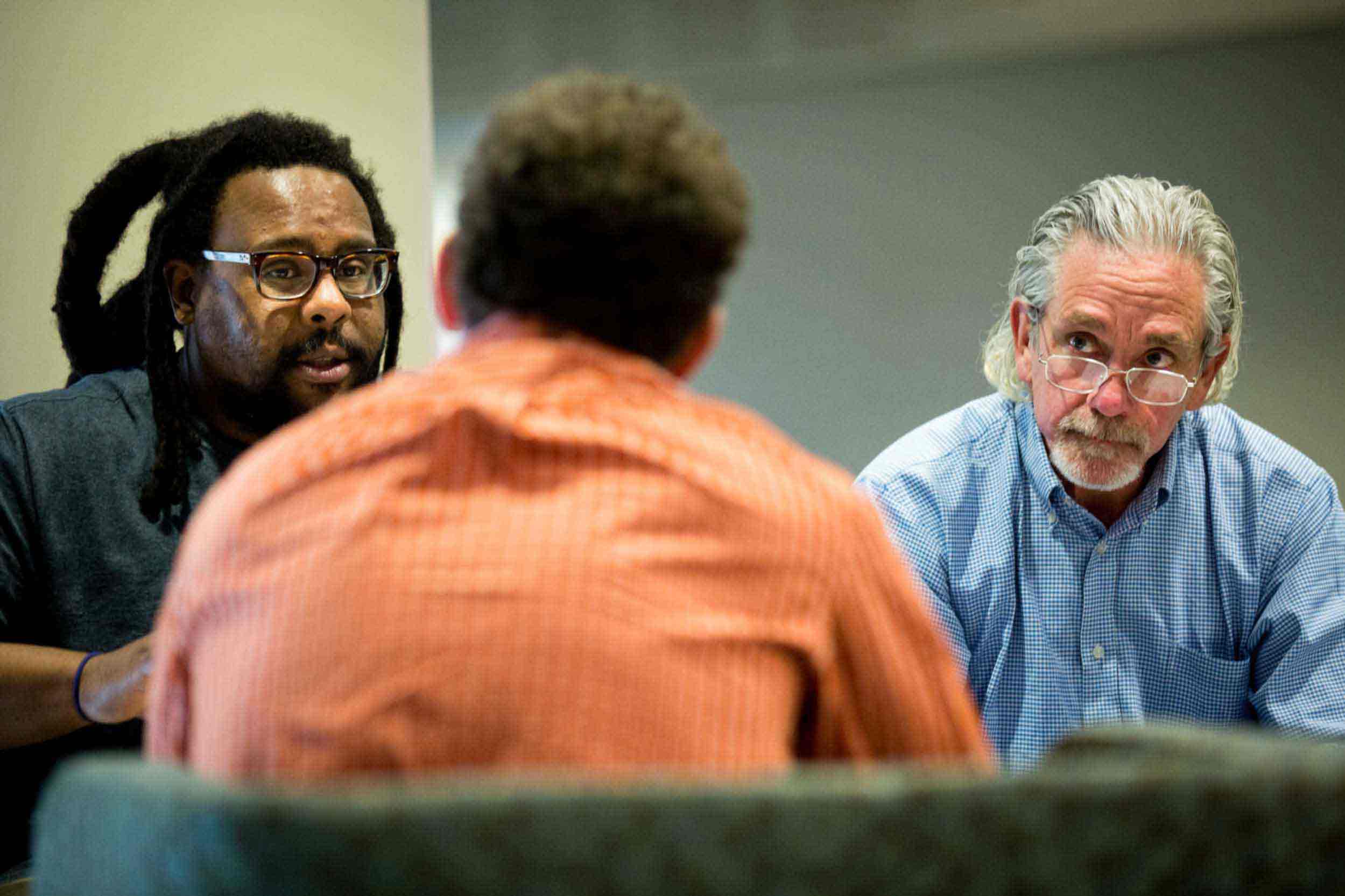 A professor and faculty member collaborate on a writing project