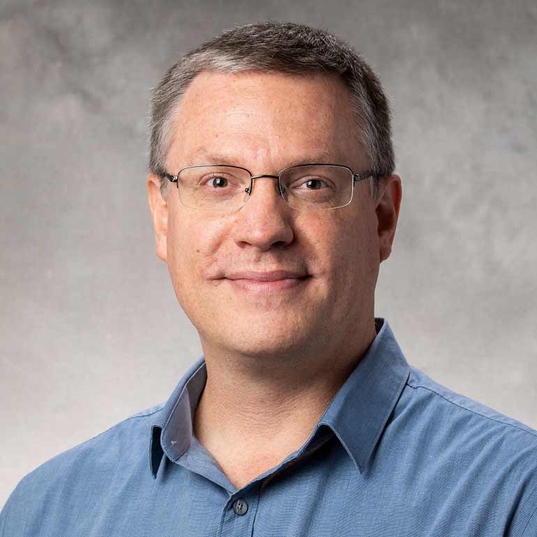Dr. Adam Green portrait photo.
